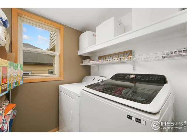 a kitchen with a stove and a window