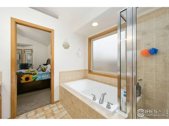 a en suite bathroom with a tub and shower