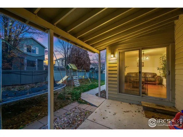 a view of a backyard with a large tree