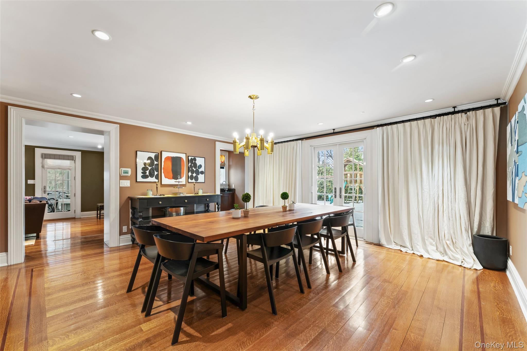 280 Clayton Road Scarsdale, NY 10583 - Photo 12 of 48 Dining Room with butlers pantry and wet bar and french doors to house length patio