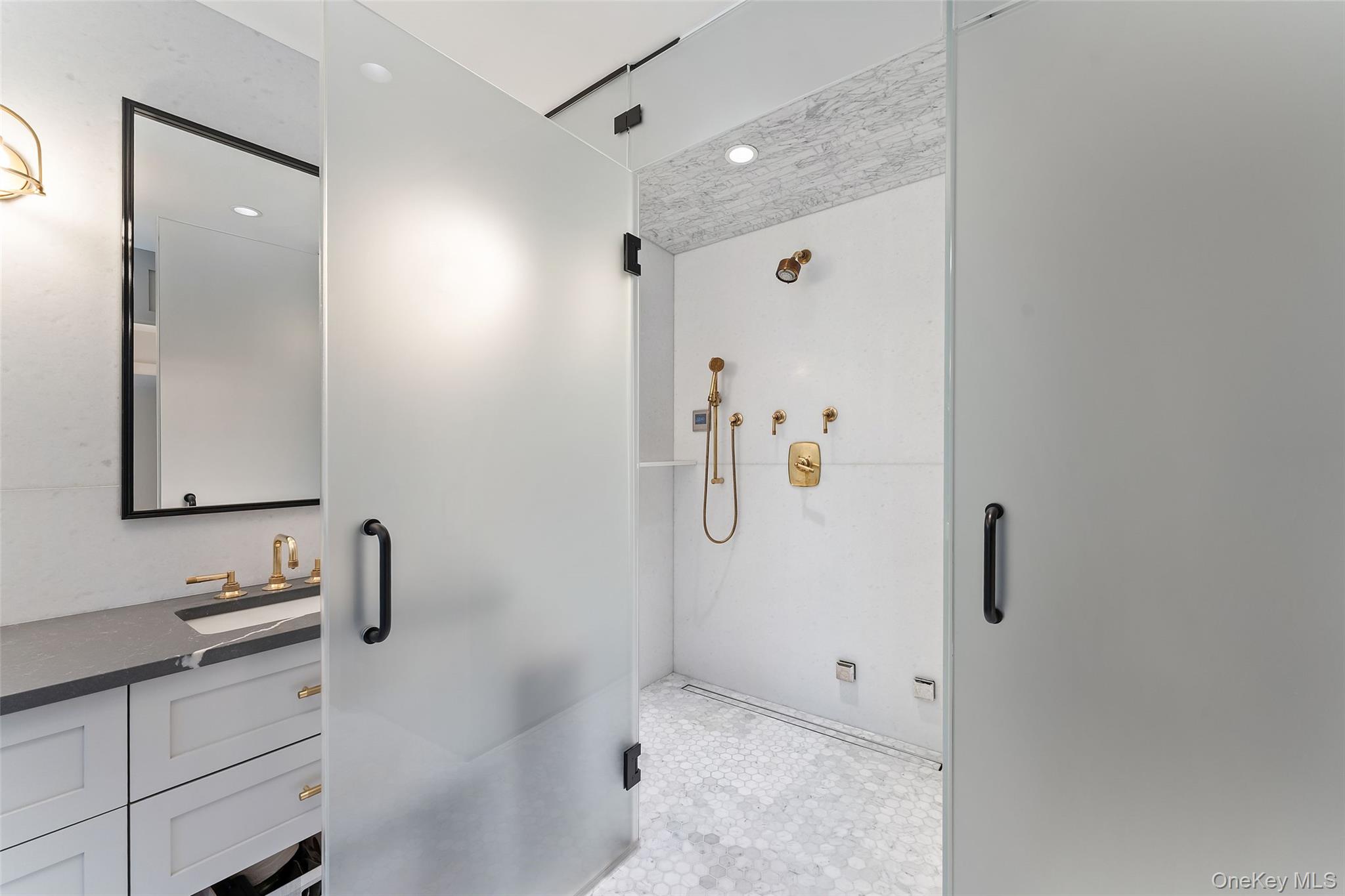 280 Clayton Road Scarsdale, NY 10583 - Photo 21 of 48 Primary bathroom with stall shower and seampless glass enclosure
