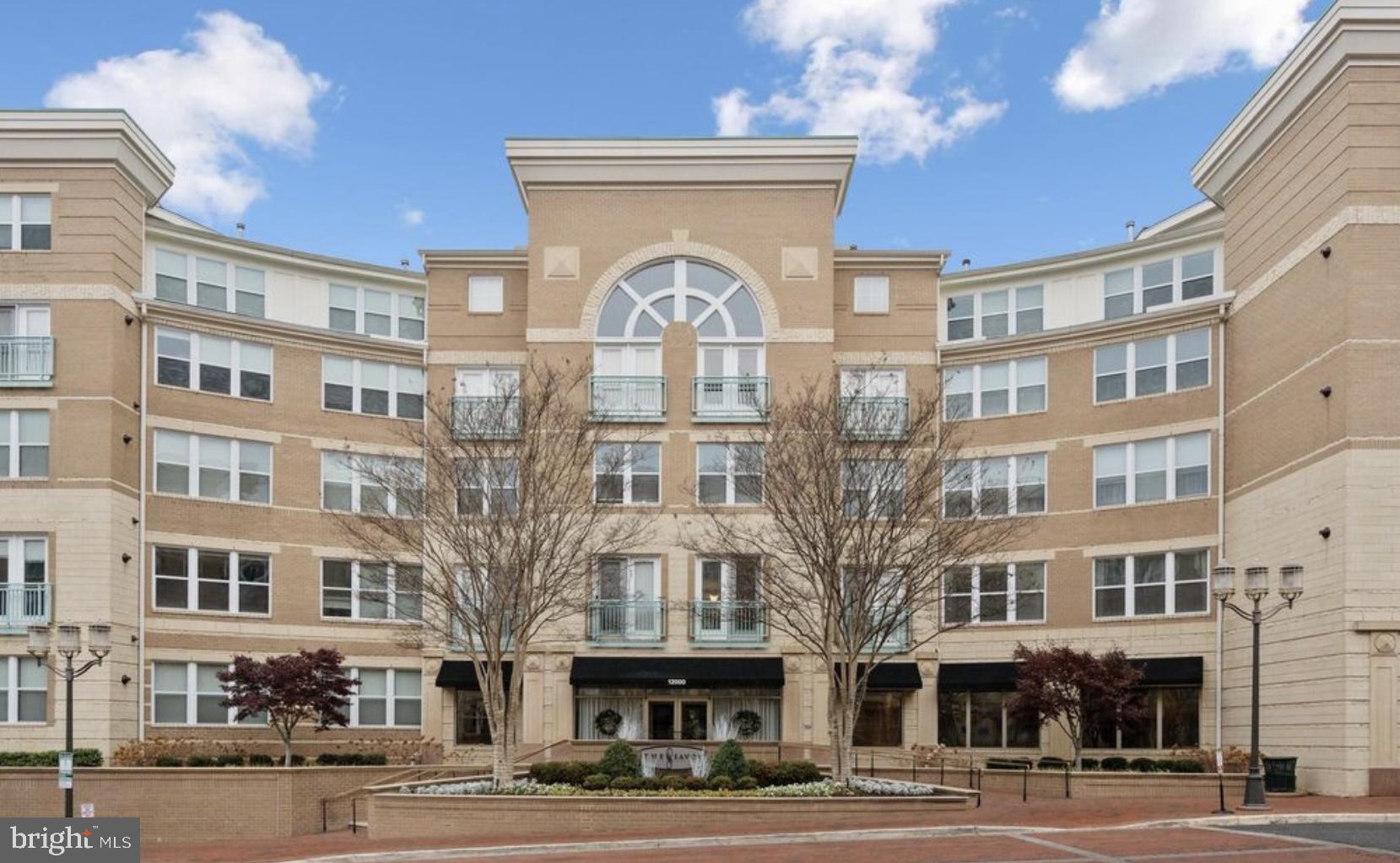 12000 Market Street, Unit 472 Reston, VA 20190 - Photo 1 of 8 a front view of a multi story building