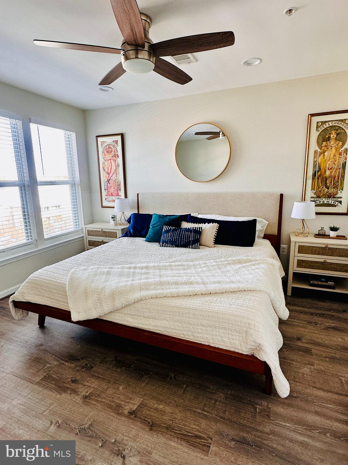 12000 Market Street, Unit 472 Reston, VA 20190 - Photo 7 of 8 a bedroom with a bed and a chandelier