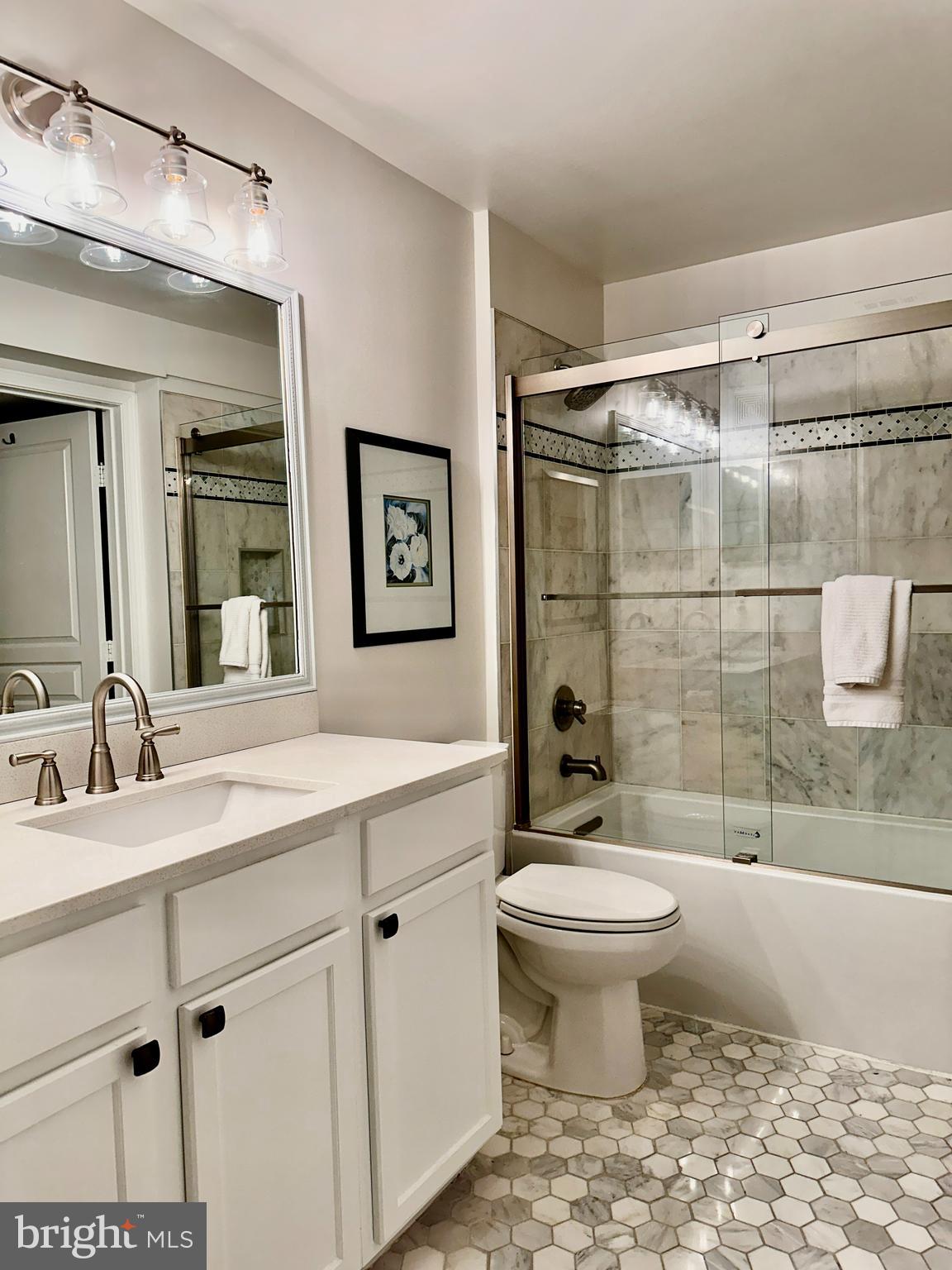 12000 Market Street, Unit 472 Reston, VA 20190 - Photo 8 of 8 a bathroom with a sink toilet and shower
