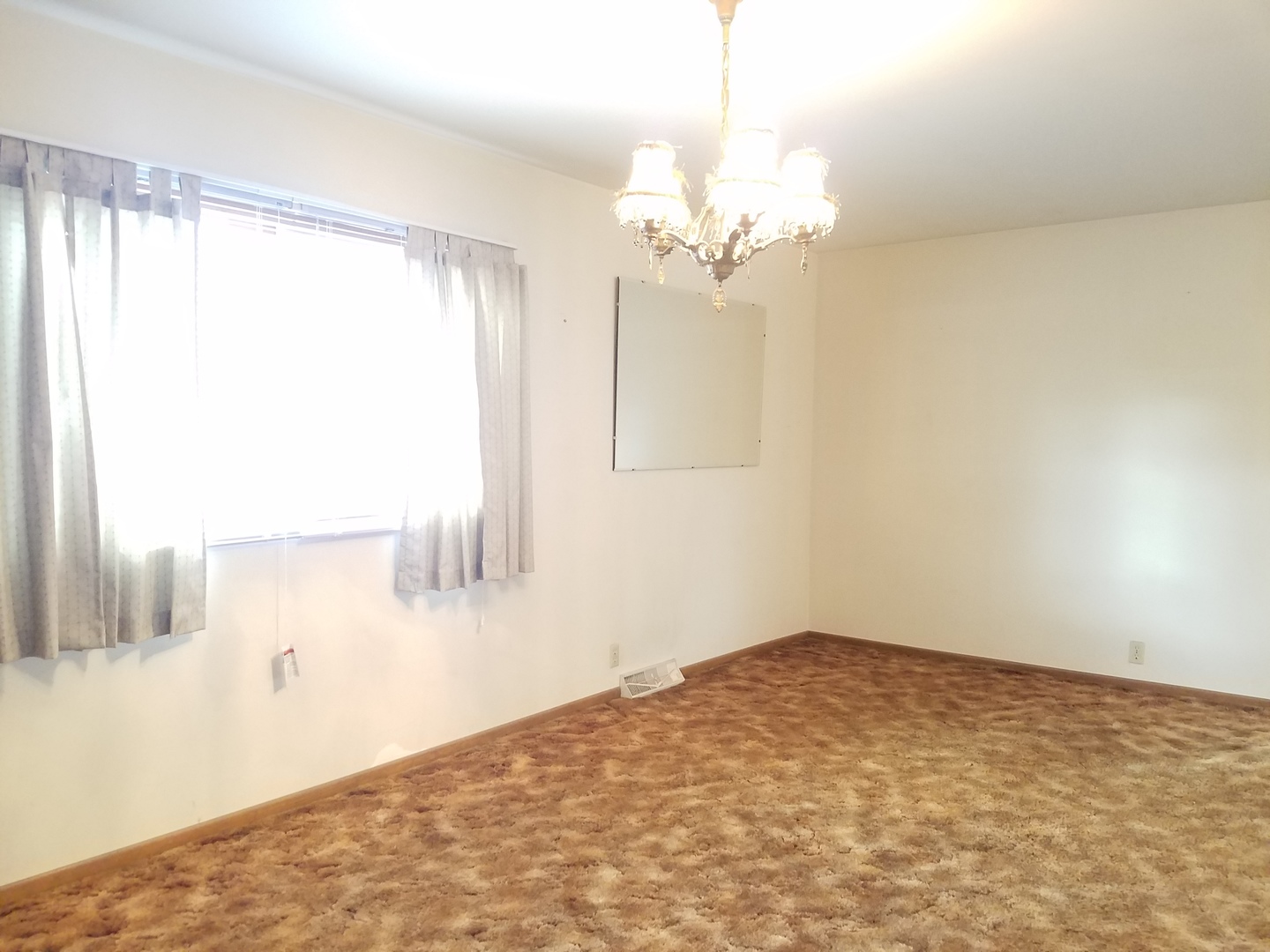 21 Durango Road Montgomery, IL 60538 - Photo 4 of 22 a view of a big room with windows and chandelier fan