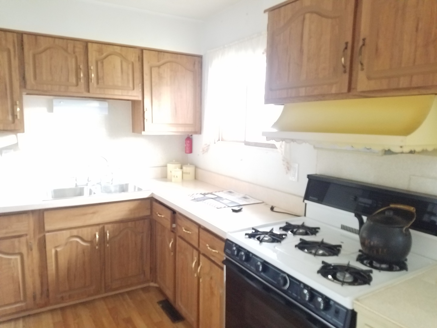 21 Durango Road Montgomery, IL 60538 - Photo 8 of 22 a kitchen with a sink stove and cabinets