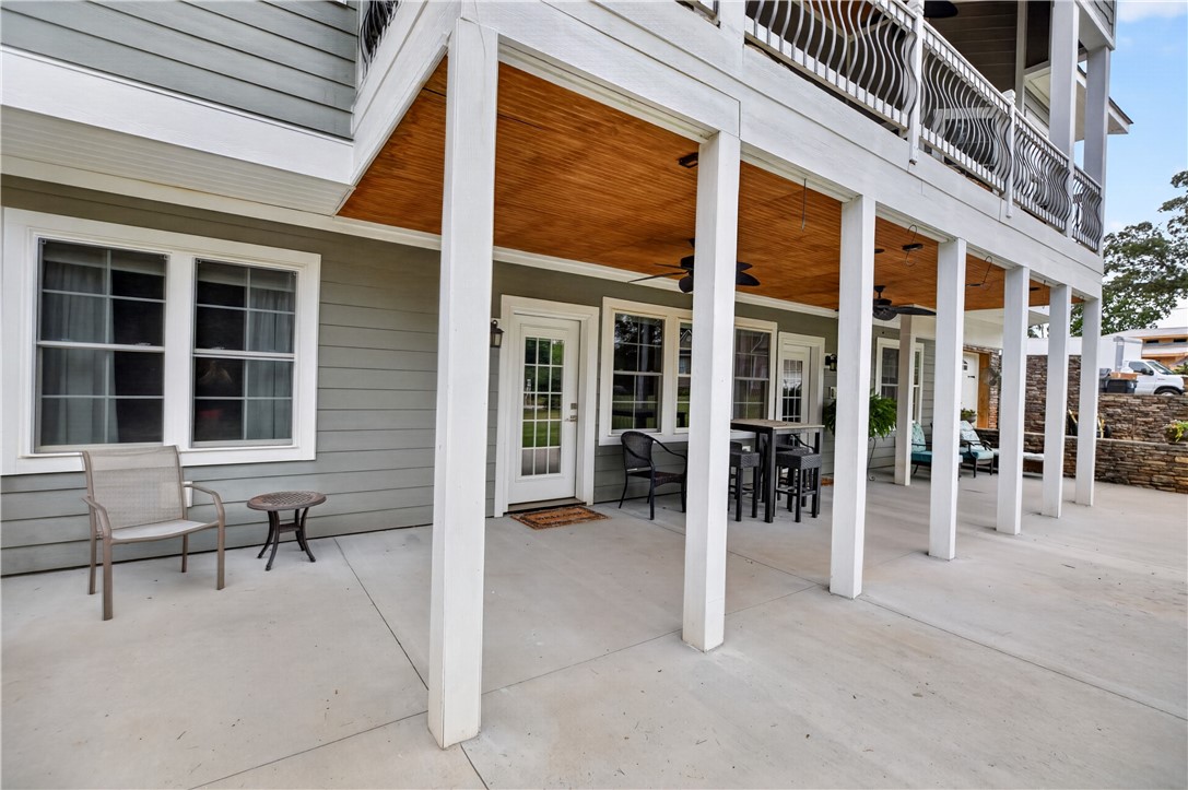 206 James Hare Road Anderson, SC 29626 - Photo 6 of 37 A spacious covered patio offers a comfortable outdoor living area beneath a second-story balcony.