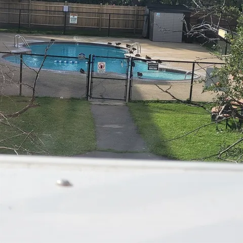a view of a terrace with wooden fence