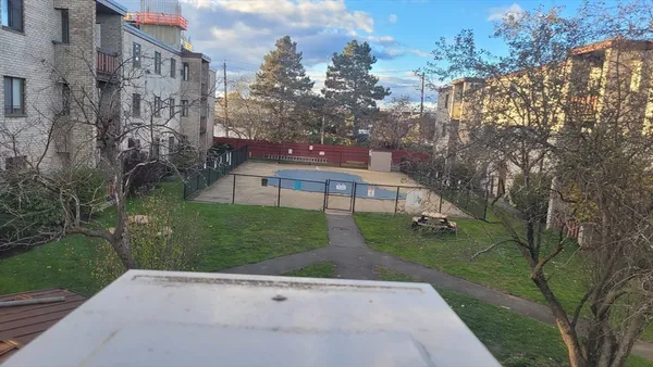 a view of a street with a building in the background