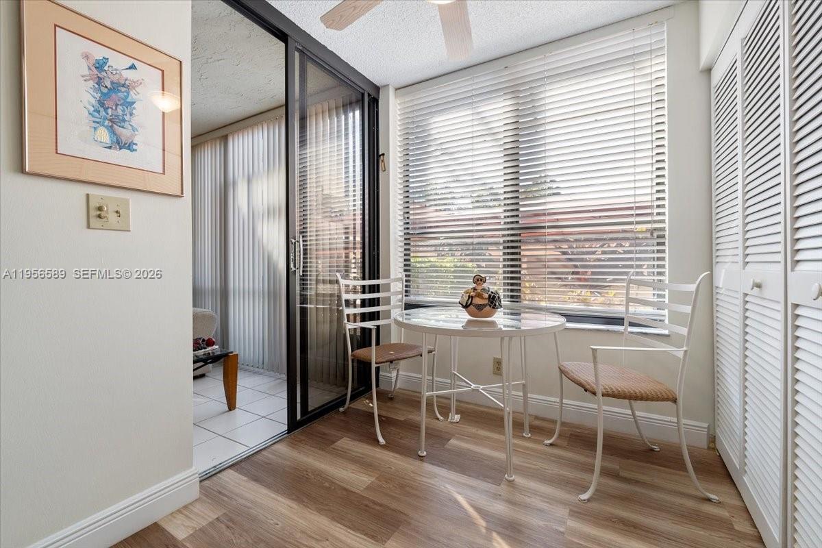 7201 Promenade Drive, Unit 101 Boca Raton, FL 33433 - Photo 21 of 54 a dining room with furniture and window