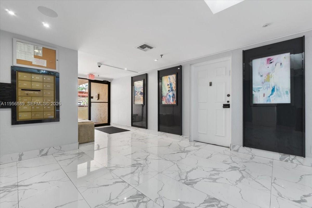 7201 Promenade Drive, Unit 101 Boca Raton, FL 33433 - Photo 42 of 54 a view of an entryway with kitchen