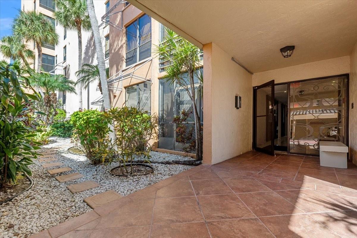 7201 Promenade Drive, Unit 101 Boca Raton, FL 33433 - Photo 49 of 54 a view of a entryway with a outdoor space