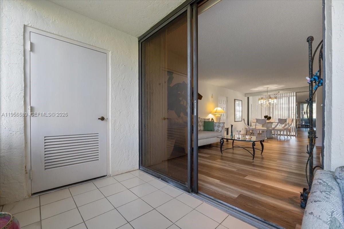 7201 Promenade Drive, Unit 101 Boca Raton, FL 33433 - Photo 54 of 54 a view of dining room with hardwood floor and a table