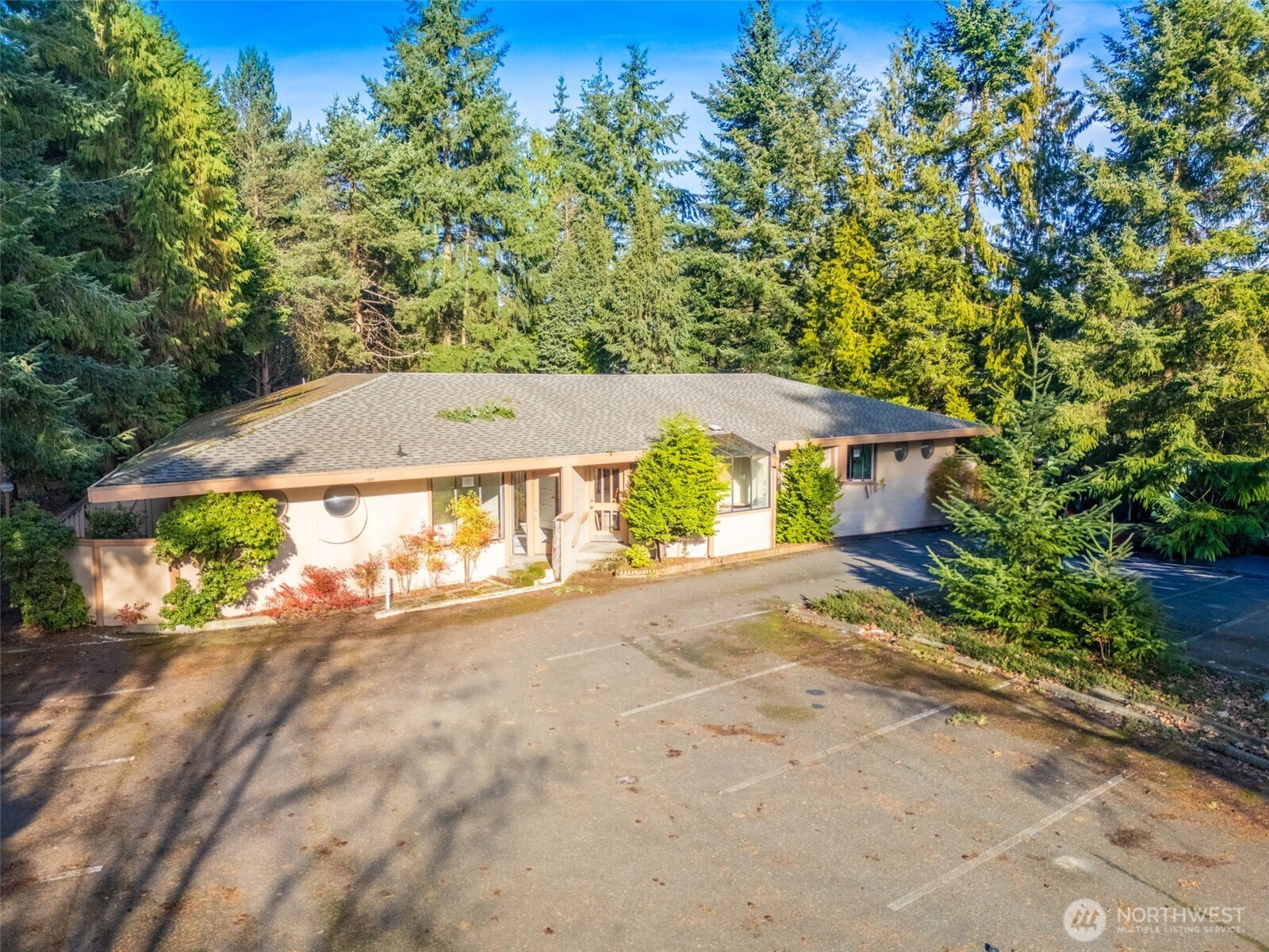 15700 Northeast Bel Red Road Bellevue, WA 98008 - Photo 10 of 11 a view of a house with a yard and garage