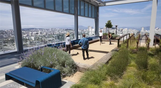a view of a patio with a table and chairs