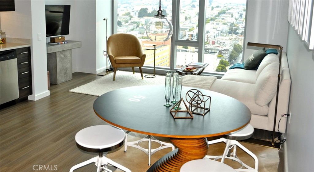 100 Van Ness Avenue, Unit 2315 San Francisco, CA 94102 - Photo 10 of 75 a living room with furniture and a fireplace