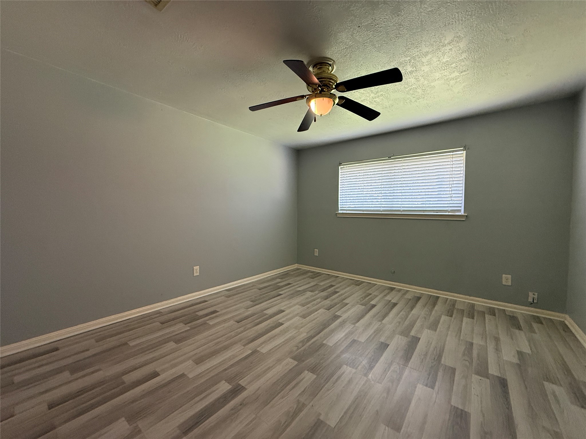 422 Gamewood Drive Spring, TX 77386 - Photo 21 of 25 a view of an empty room with wooden floor and a window