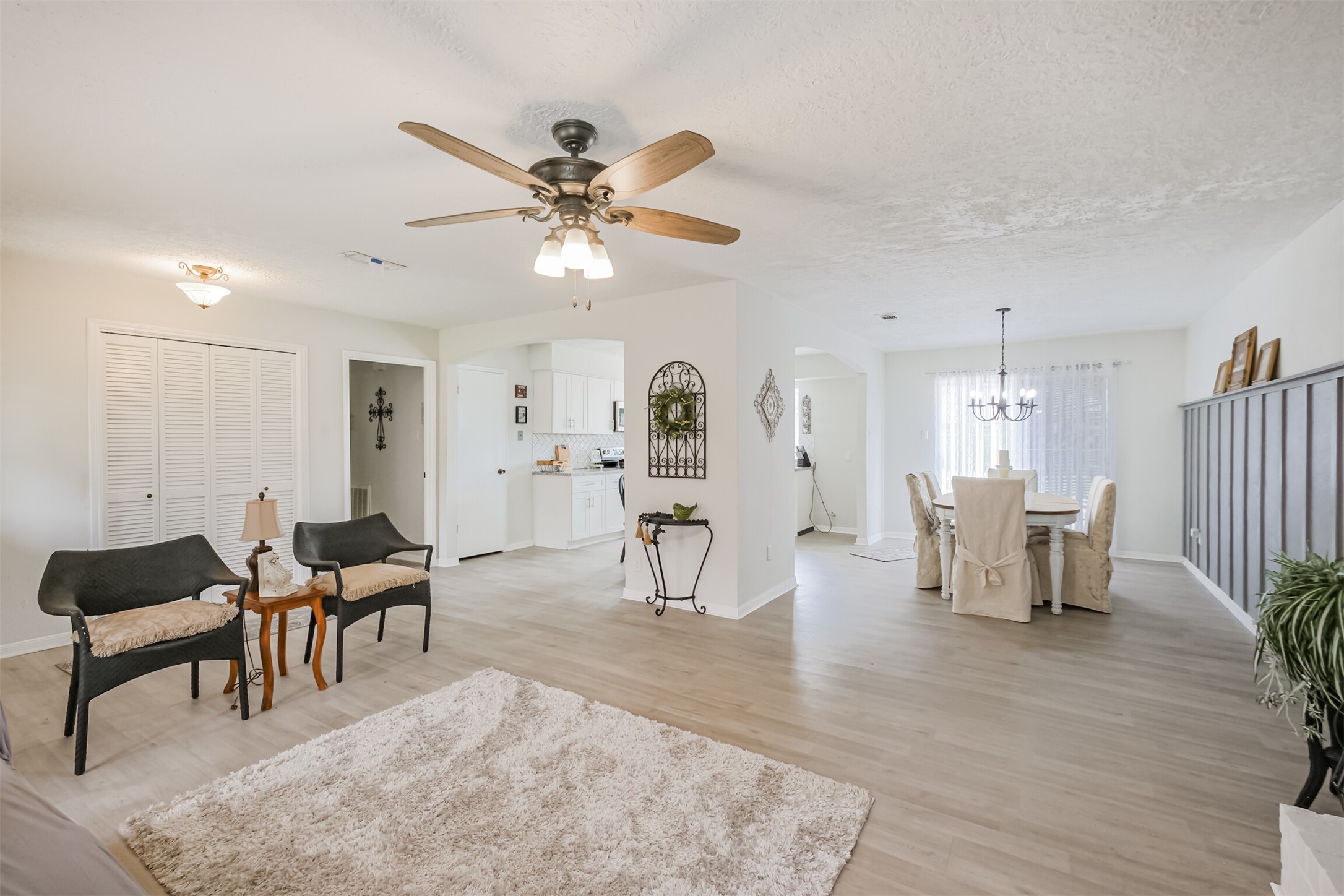 2705 Parrott Avenue Rosenberg, TX 77471 - Photo 6 of 37 a living room with furniture and a chandelier
