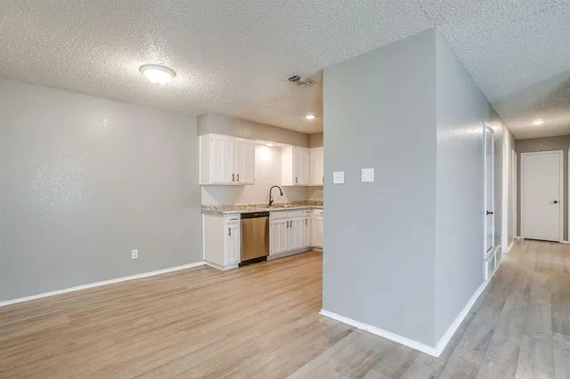 a view of kitchen with wooden floor