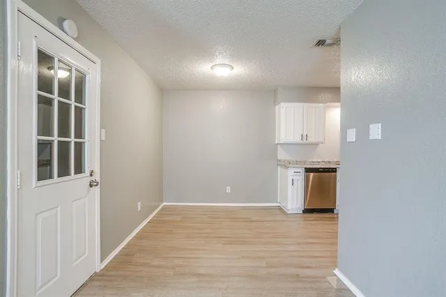 a view of a kitchen with a sink and dishwasher