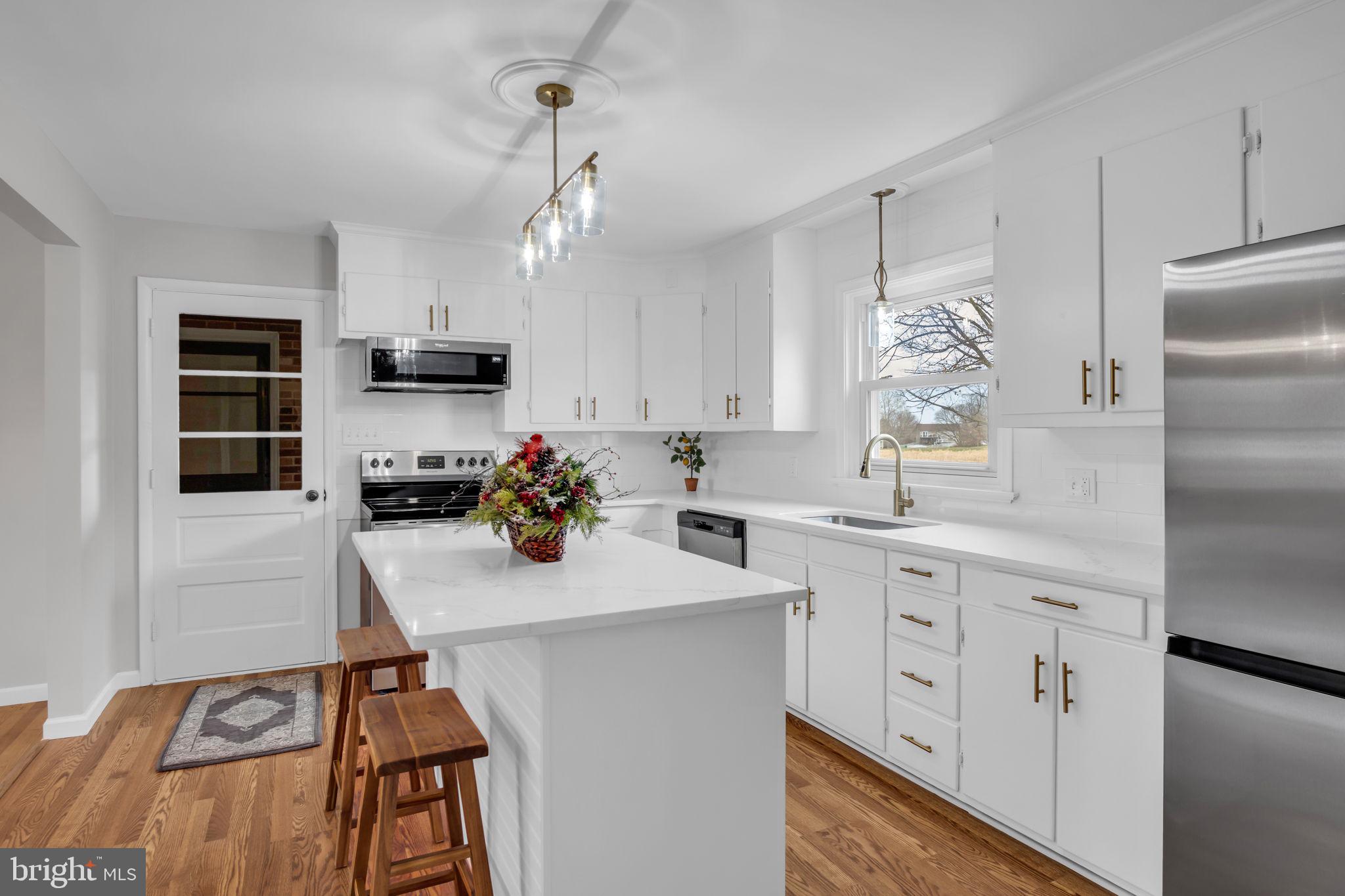 2029 Stoverstown Road Spring Grove, PA 17362 - Photo 15 of 77 a kitchen with appliances a sink cabinets and a counter top space