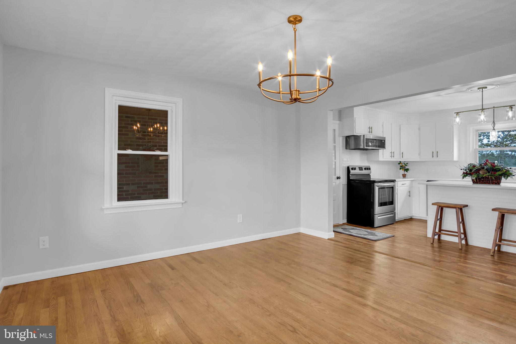 2029 Stoverstown Road Spring Grove, PA 17362 - Photo 16 of 77 a view of a kitchen with a stove wooden cabinets and wooden floor