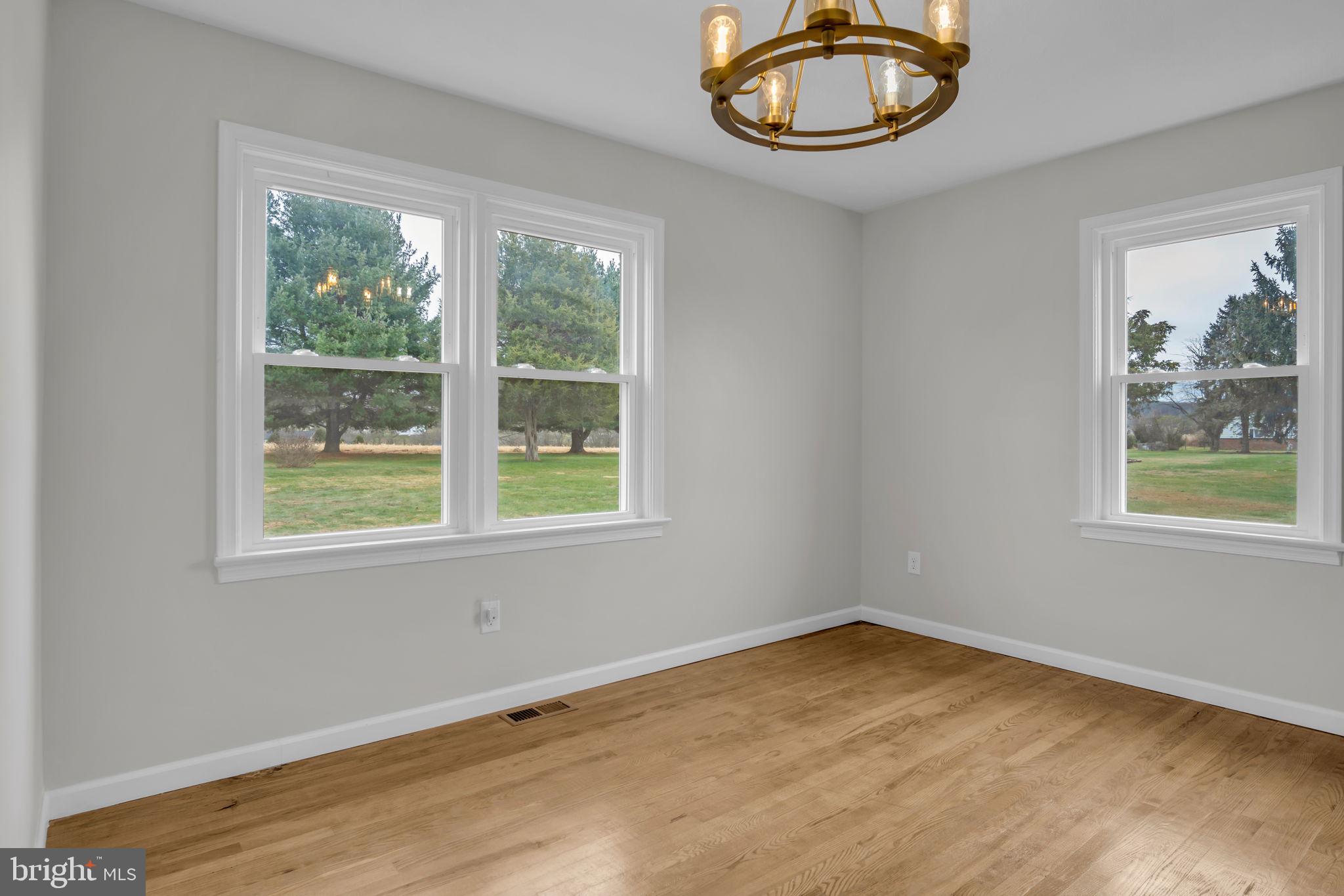 2029 Stoverstown Road Spring Grove, PA 17362 - Photo 25 of 77 a view of an empty room with a window and wooden floor