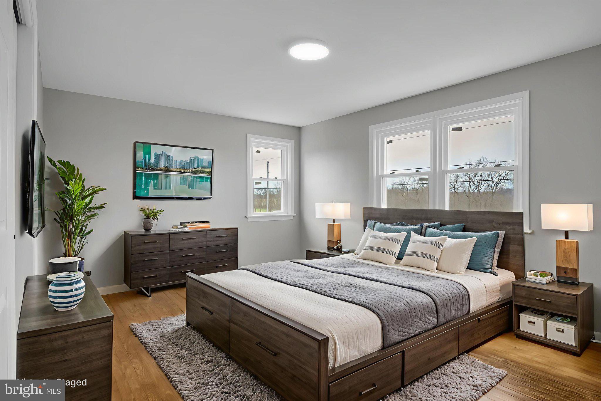 2029 Stoverstown Road Spring Grove, PA 17362 - Photo 33 of 77 a bedroom with a bed and a potted plant with the dresser