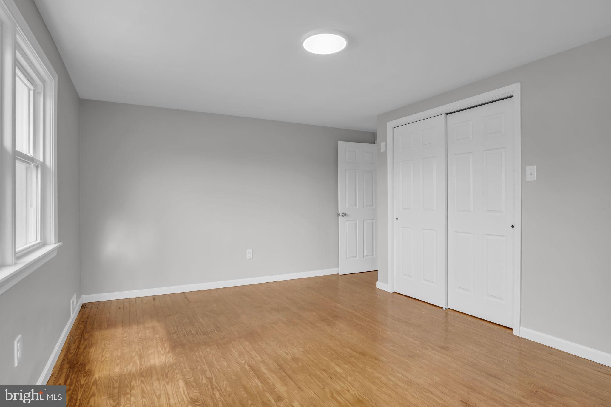 2029 Stoverstown Road Spring Grove, PA 17362 - Photo 34 of 77 an empty room with wooden floor and windows