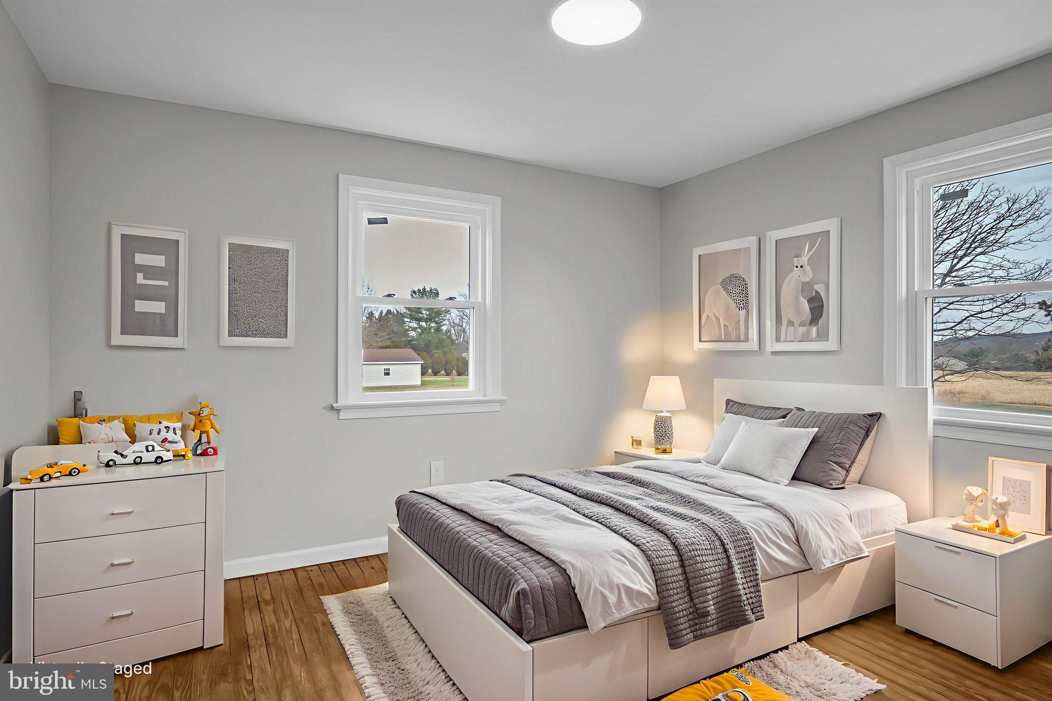 2029 Stoverstown Road Spring Grove, PA 17362 - Photo 40 of 77 a bedroom with a bed and wooden floor