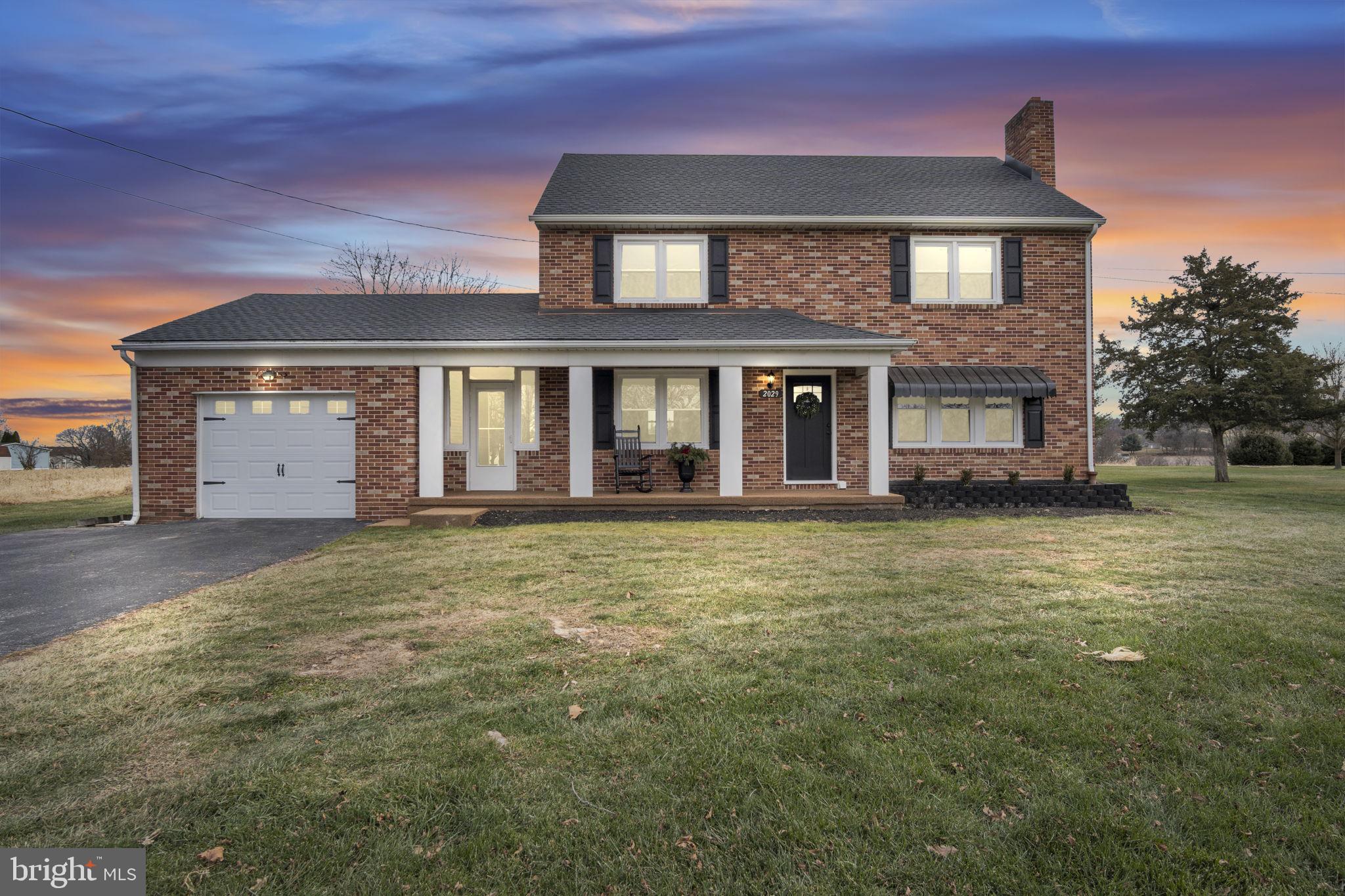 2029 Stoverstown Road Spring Grove, PA 17362 - Photo 4 of 77 a front view of a house with a garden