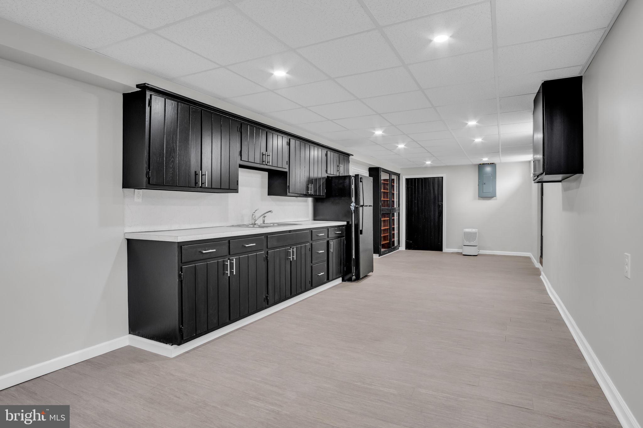 2029 Stoverstown Road Spring Grove, PA 17362 - Photo 54 of 77 a large white kitchen with a sink and refrigerator