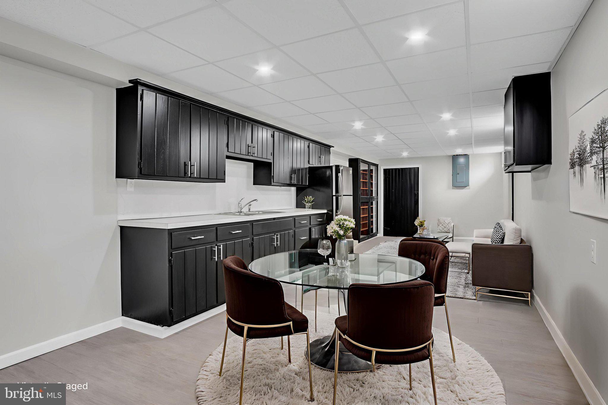 2029 Stoverstown Road Spring Grove, PA 17362 - Photo 55 of 77 a kitchen with a dining table chairs and refrigerator