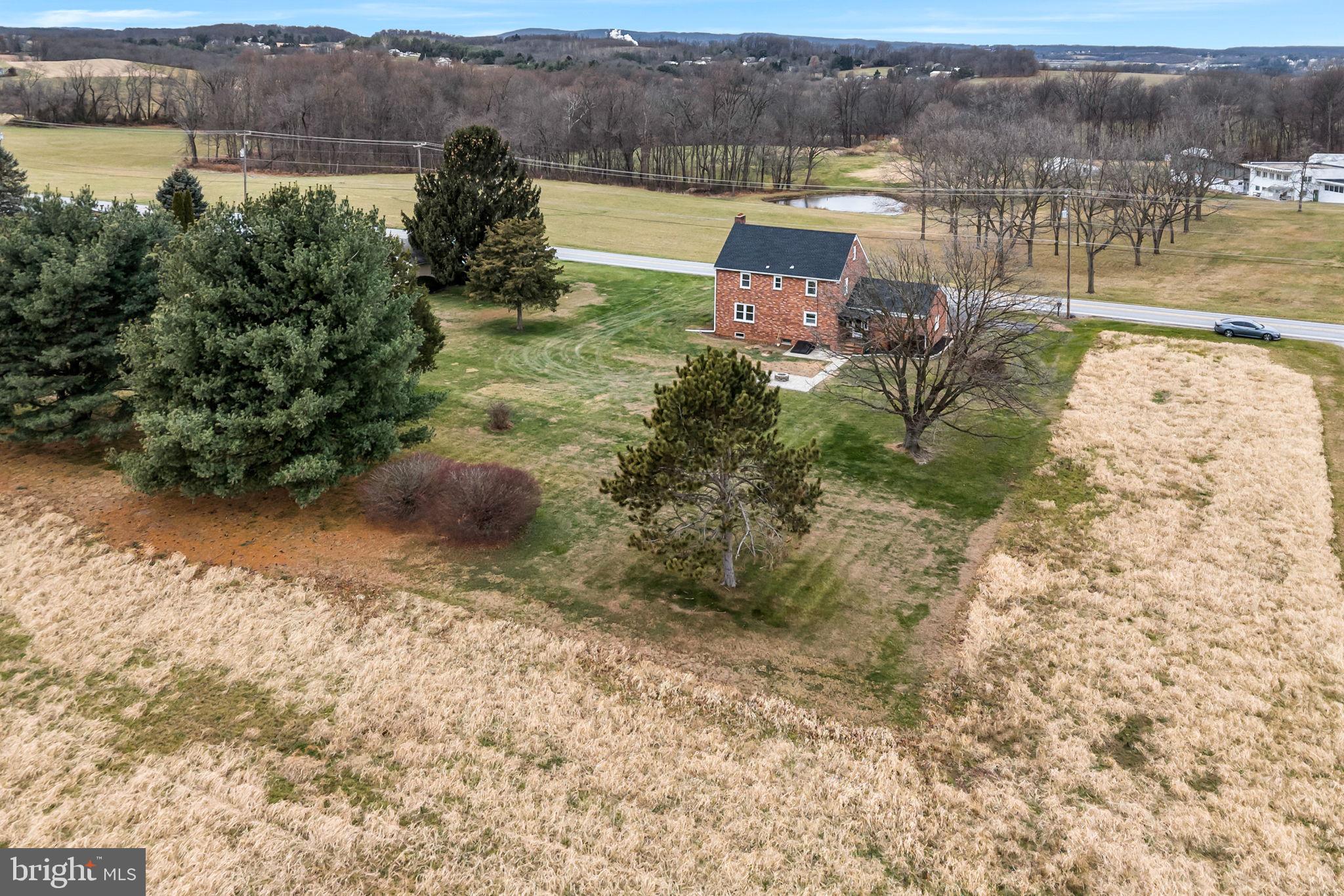 2029 Stoverstown Road Spring Grove, PA 17362 - Photo 70 of 77 an aerial view of a house with a yard and lake view