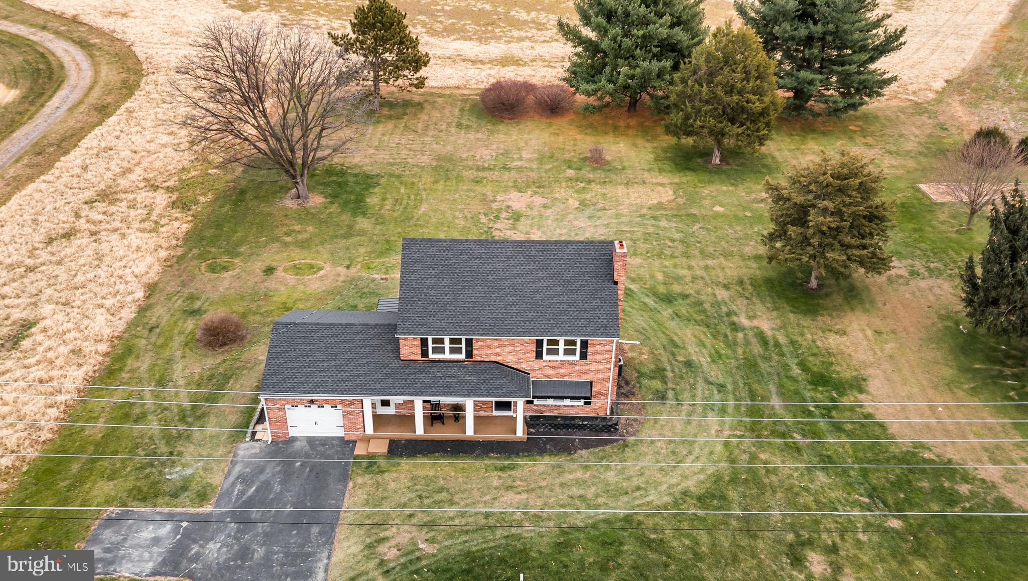 2029 Stoverstown Road Spring Grove, PA 17362 - Photo 9 of 77 a aerial view of a house with swimming pool and large trees