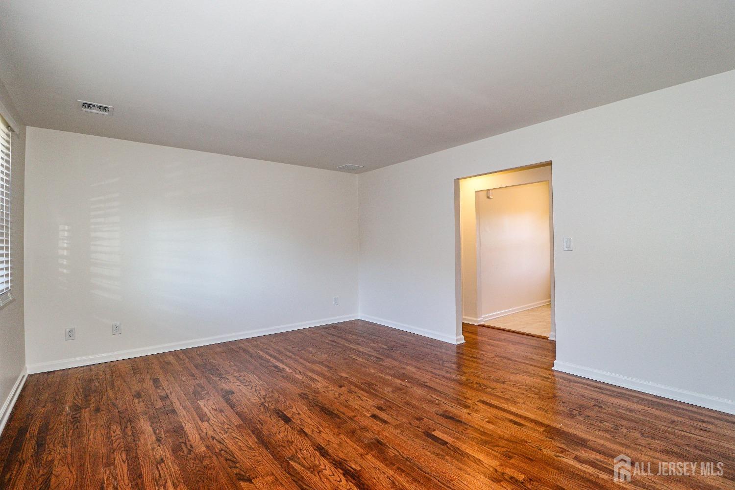 298 Central Avenue, Unit 4A Edison, NJ 08817 - Photo 12 of 12 wooden floor in a empty room