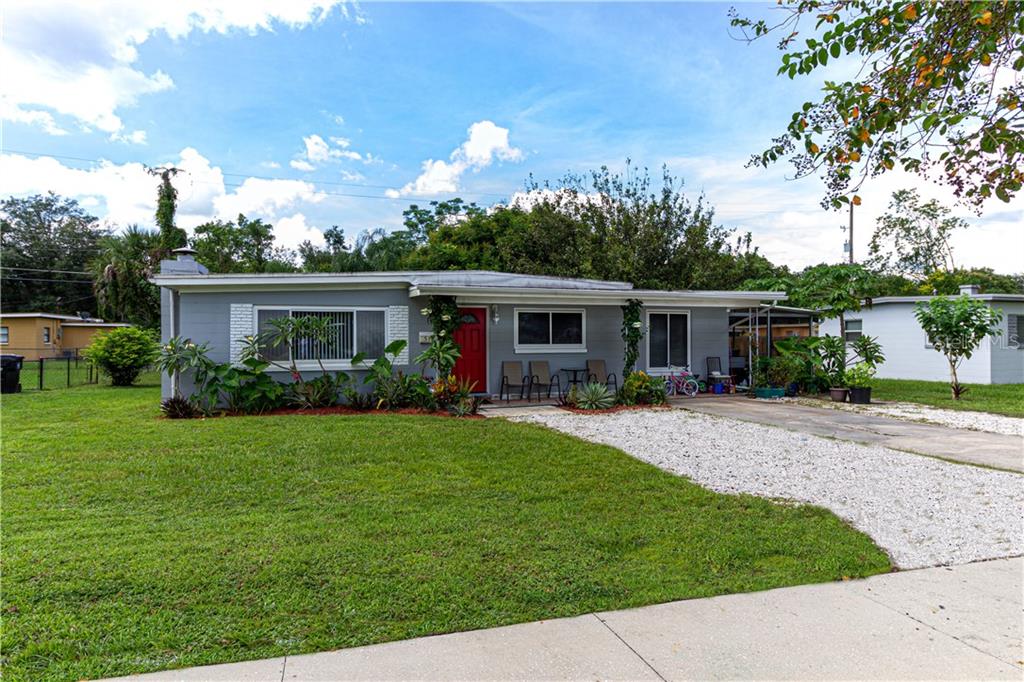 518 Gaston Foster Road Orlando, FL 32807 - Photo 1 of 1 a front view of house with a garden