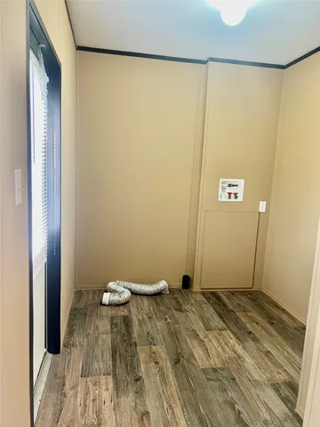 a view of a room with wooden floor