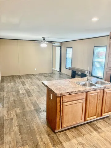 a view of a kitchen with granite countertop cabinets and sink