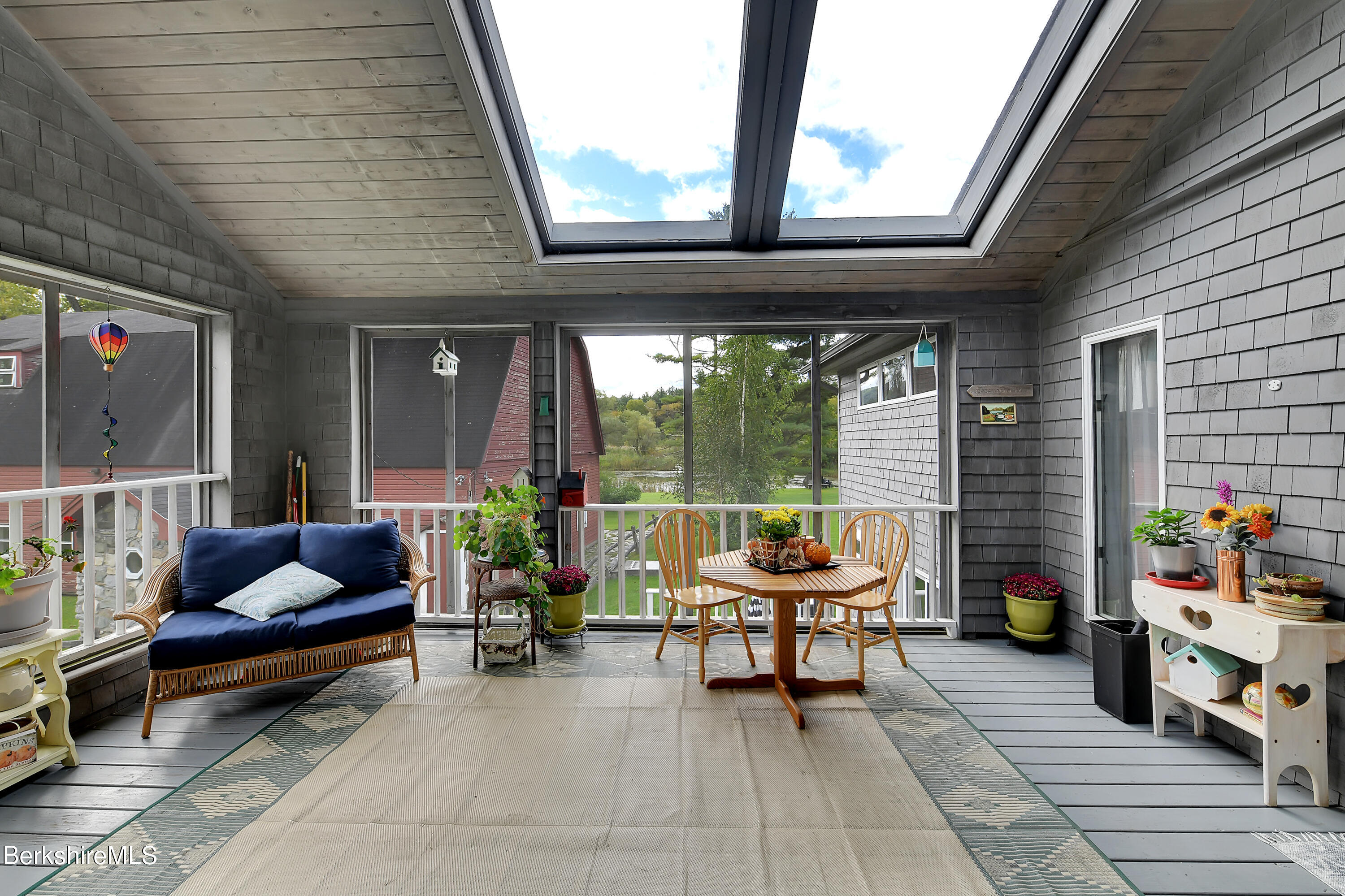 2 Wallace Road, Unit 2E Stockbridge, MA 01262 - Photo 2 of 33 a balcony with furniture and a potted plant