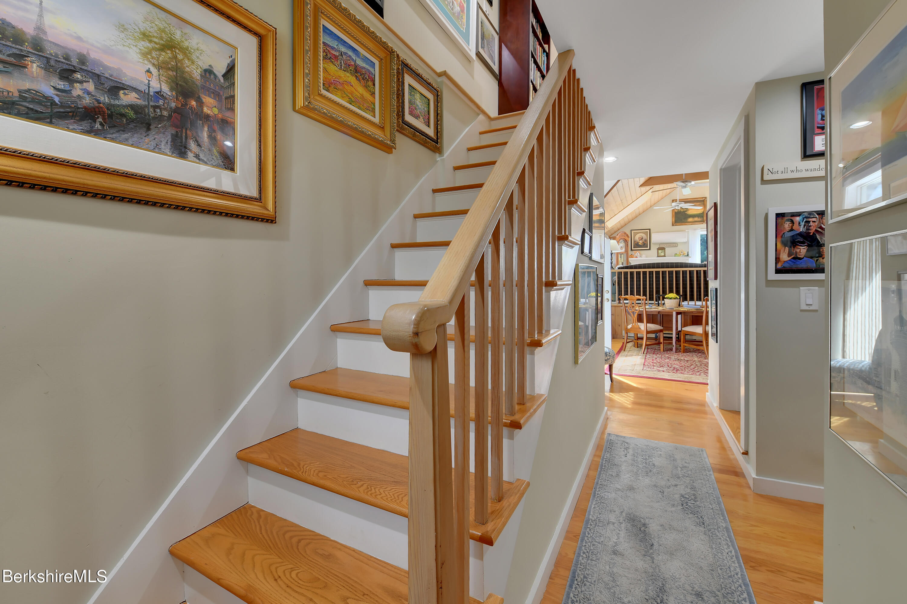 2 Wallace Road, Unit 2E Stockbridge, MA 01262 - Photo 20 of 33 a view of staircase with lots of frames on wall and a large window
