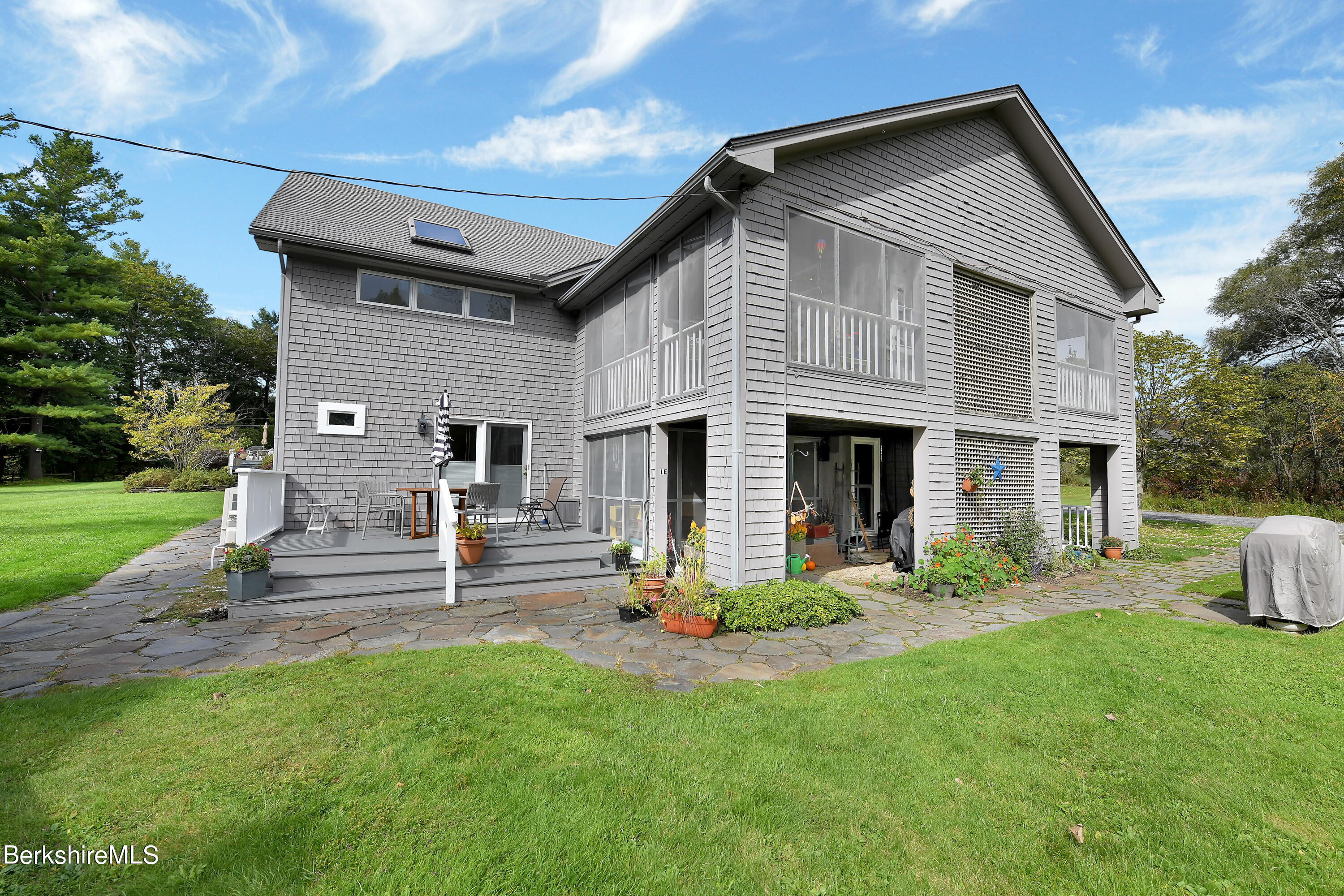 2 Wallace Road, Unit 2E Stockbridge, MA 01262 - Photo 26 of 33 a front view of a house with a yard