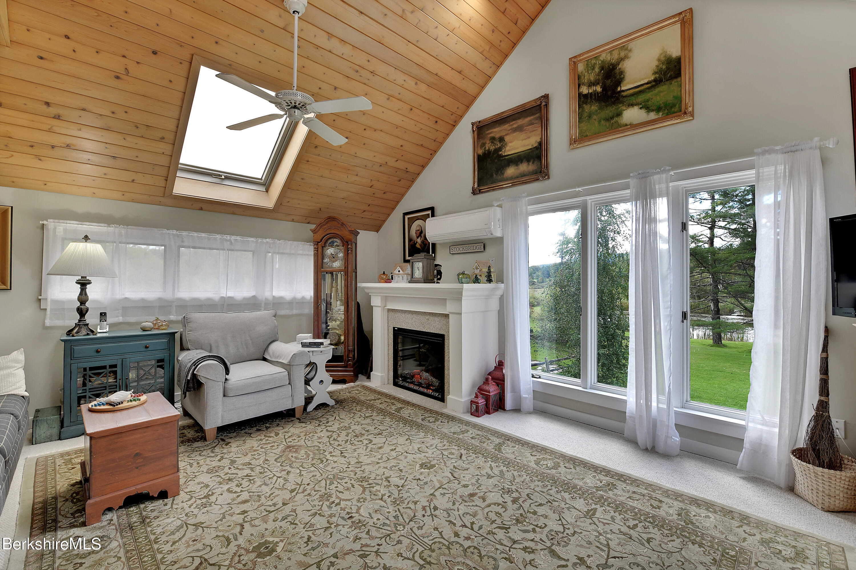 2 Wallace Road, Unit 2E Stockbridge, MA 01262 - Photo 6 of 33 a living room with furniture and a fireplace