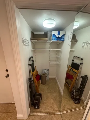 a view of a closet with storage