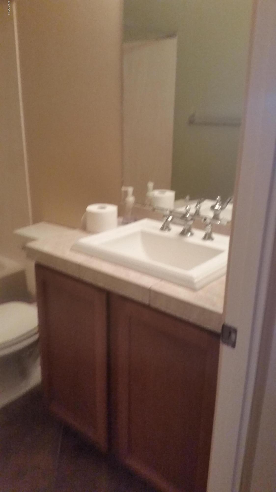 478 East Cedarvale Road Tucson, AZ 85704 - Photo 14 of 39 a bathroom with a sink and a toilet