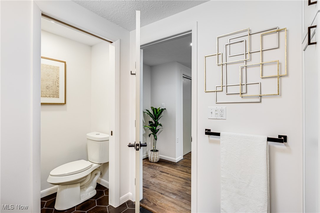 3691 Lyntz Road Warren, OH 44481 - Photo 18 of 36 Bathroom featuring a textured ceiling and dark tile patterned flooring