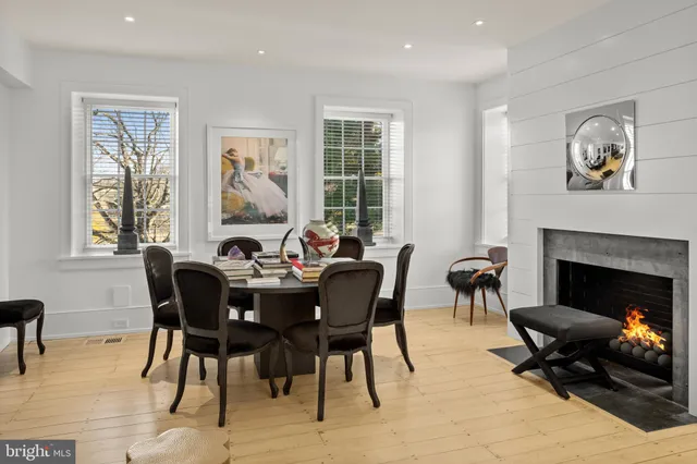a view of a livingroom with furniture and a fireplace