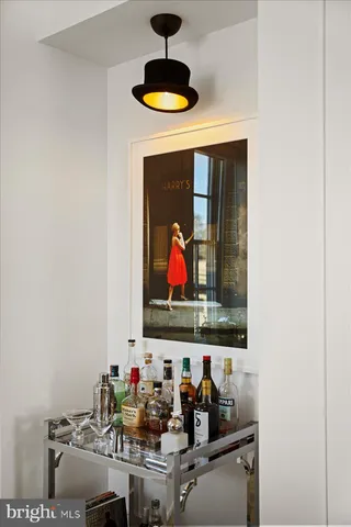 a room with furniture and wall paintings