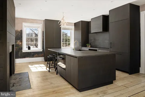 a kitchen with stainless steel appliances granite countertop a refrigerator and a stove