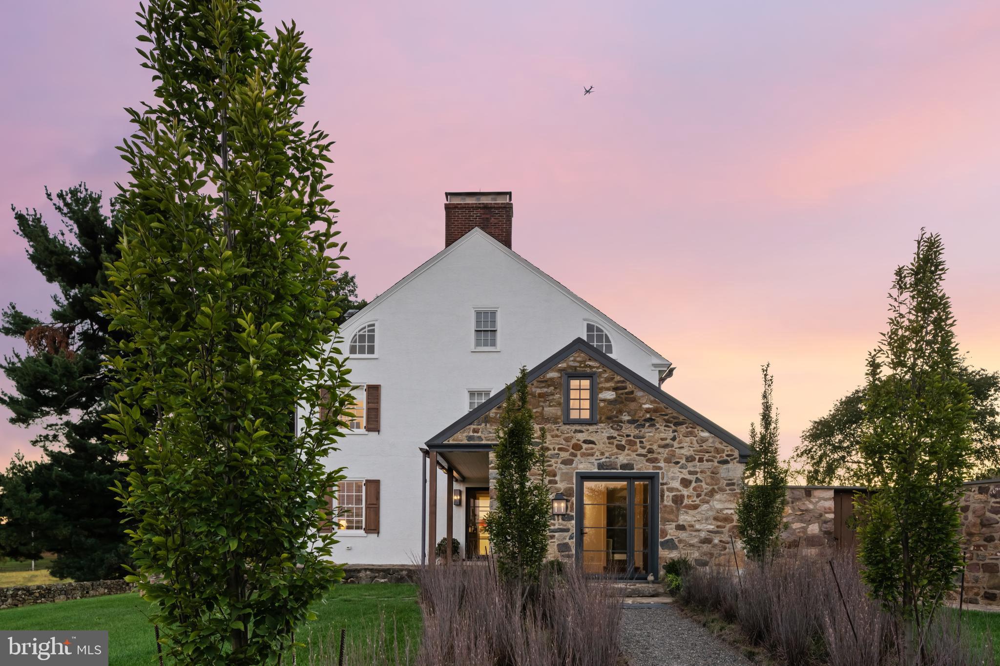 864 Grubbs Mill Road Newtown Square, PA 19073 - Photo 2 of 50 a front view of a house with a yard